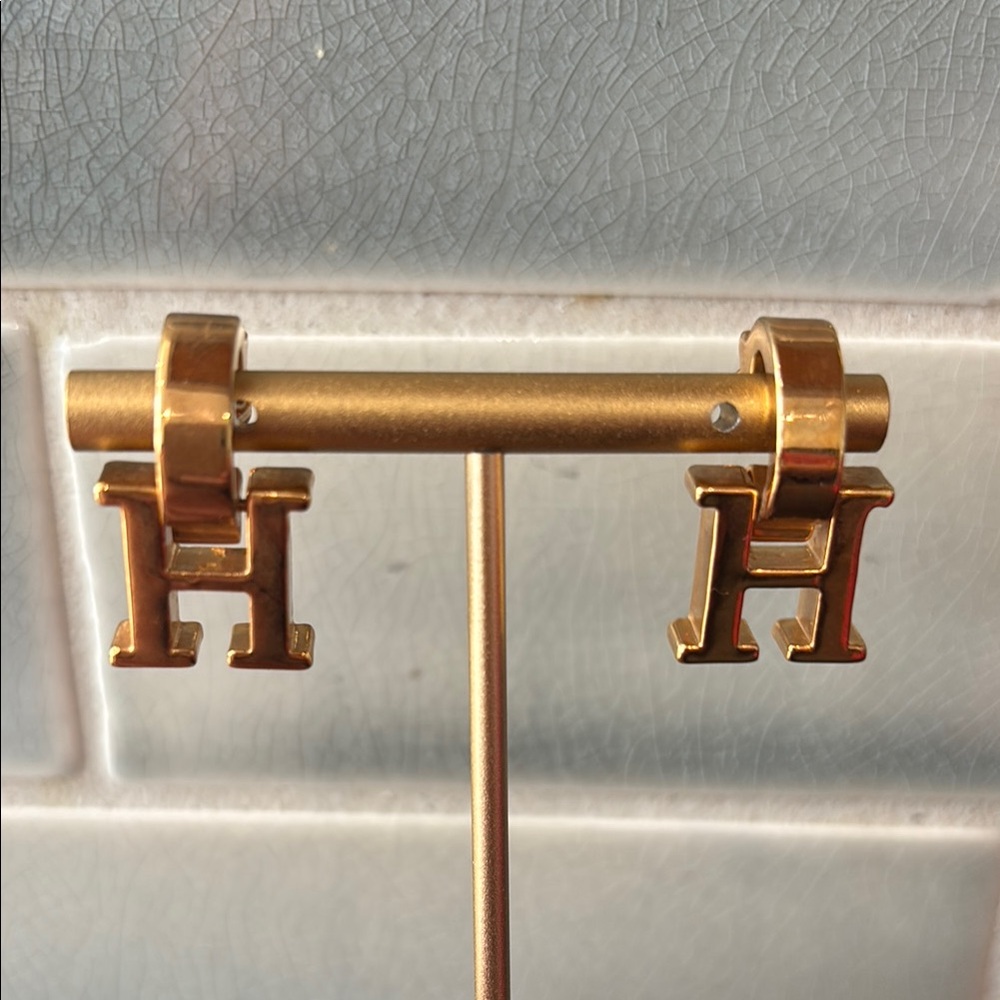 Carolina Herrera Gold tone CH Earrings